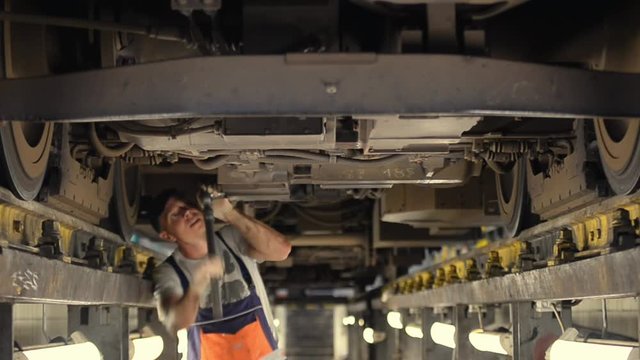 a man repairing a train