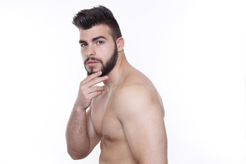 Fototapeta premium Attraktiver, muskulöser Mann schaut nachdenklich in die Kamera