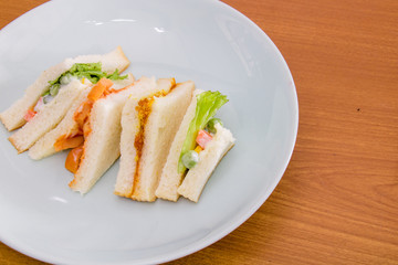 delicious sandwich with ham vegeable bread on  white dish , home made sandwich, health food