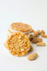 Sweet cookies with caramelized peanuts on white