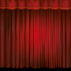 Spotlight on a red stage curtain.