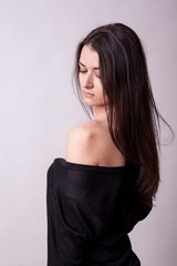 Naklejka premium Beautiful woman on gray background. Sexy lady. Perfect beautiful attractive female posing in model test in studio