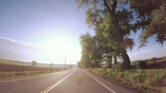 POV point of view - Driving on rural roads in farmland on Midwest