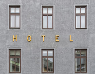 Hotel Sign Near Windows