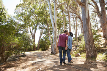 Romantic Couple Hiking Along Forest Path Together