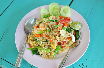 Shrimp fried rice on wood table.