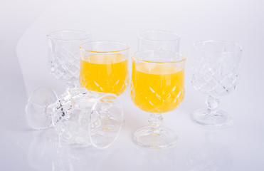 Orange juice in glasses on white background.