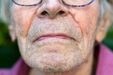 Lower face of an old man with stubble