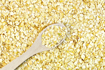 Pea flakes texture with wooden spoon