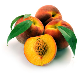 Fresh peach with green leaf isolated on white background