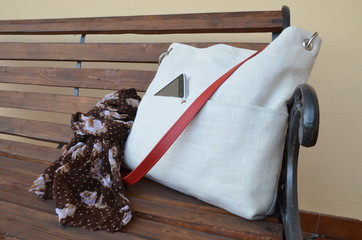 A white bag with red belt - closeup