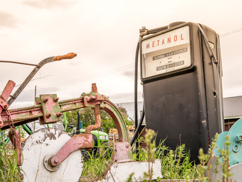 Vintage gas pump, methanol. On scrapyard farm, Sweden.