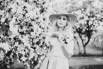 portrait of a beautiful girl in blossoming Apple trees