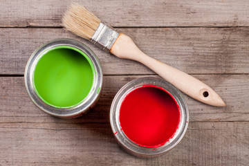 green and red paint in the bank to repair and brush on the old wooden background