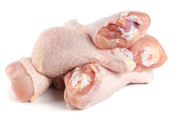 raw chicken drumsticks isolated on white background
