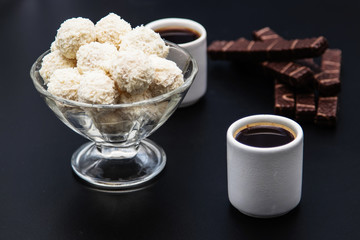 black coffee sweets on a black background