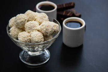 black coffee sweets on a black background