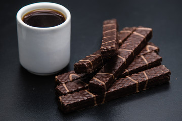 black coffee sweets on a black background