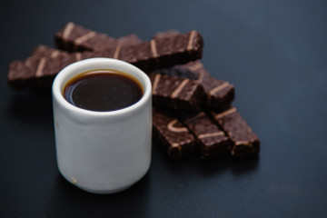 black coffee sweets on a black background