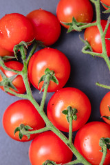 Cherry tomatoes on a black background. close-up