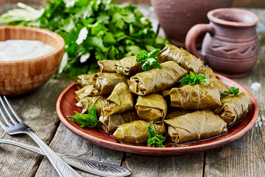 Dolma(tolma, sarma) - stuffed grape leaves with rice and meat. Traditional Caucasian, Ottoman, Turkish and Greek cuisine
