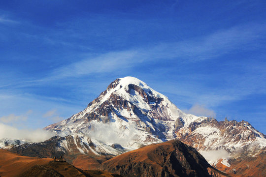 Fototapeta most large and big and high peak in Georgia Mkhinvarthveri or mount Khazbegi