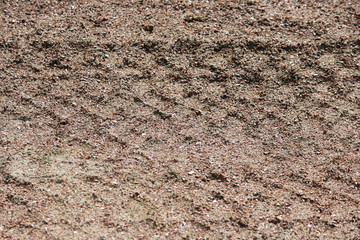Wheel tracks in the mud, detail footprints bulldozer in the construction road