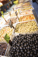 assortment of olives in a grocery store