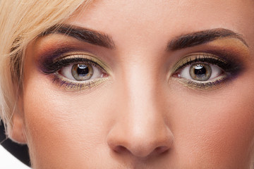 Close up photo of young woman with perfect make up. Professional make up and attractive young model
