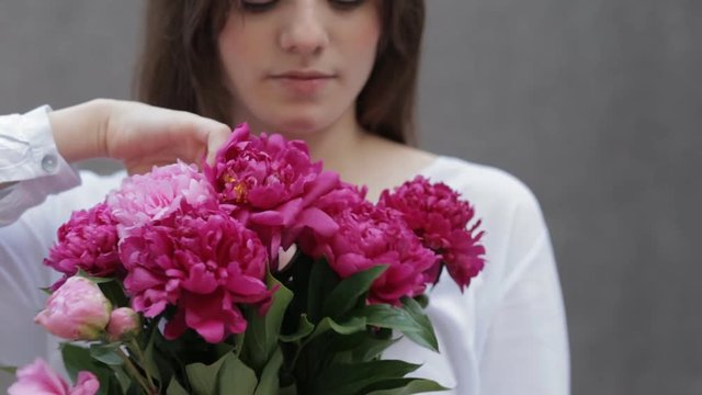 Woman sniff flowers bouquet
