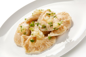 Dumplings - stuffed cheese noodles on white background