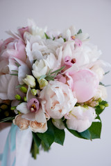 The bride's bouquet of soft pink peonies and white roses . Wedding floristry. Classic form