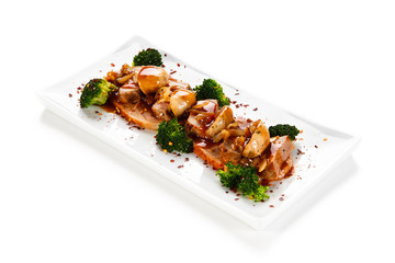 Grilled meat with broccoli and mushrooms on white background