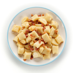 Potato noodles - dumplings on white background