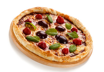 Pizza with plums and strawberries on white background