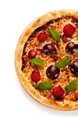 Pizza with plums and strawberries on white background