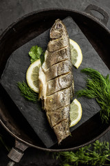 Baked rainbow trout fish with dill and lemon. Restaurant. Seafood 