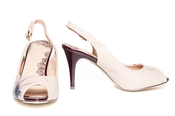 female beige shoes on a white background