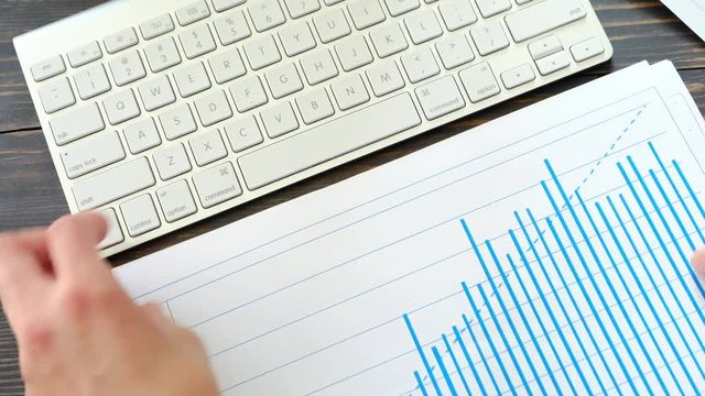 Businesswoman working with diagram, closeup shot