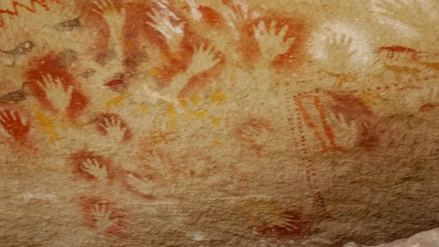 RIO PINTURAS, SANTA CRUZ, ARGENTINA - JANUARY 30, 2017: Cave paintings in Cave of hands in valley of Pinturas River (Cueva de las Manos del Rio Pinturas). Patagonia, Argentina, Santa Cruz


