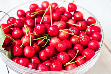 bunch of cherry with water drops in the bowl