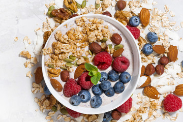homemade muesli with yogurt and berries, top view