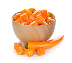 Chili slice in a cup on white background