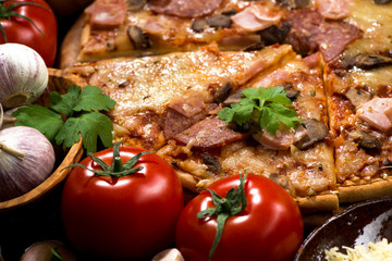pizza with sausage and cheese and variety of ingredients, selective focus, closeup
