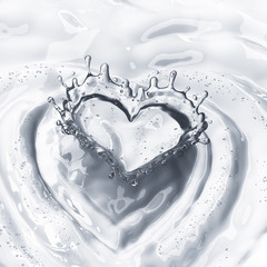 Heart from water splash with bubbles isolated on white