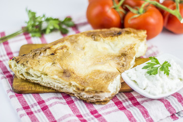 Cheese burek composition on white background