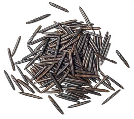 uncooked black wild rice on white, top view