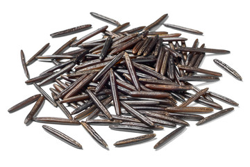 uncooked black wild rice on white,(large depth of field, taken with tilt shift lens)