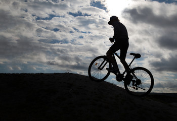 Fototapeta na wymiar Silhouette of Mountain bike.Sport and healthy life.Extreme sports.Mountain bicycle and man.Life style outdoor extreme sport