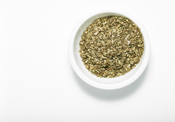 Bowl of dried oregano leaves